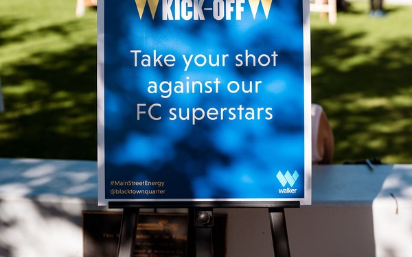 Sign on an easel at the Blacktown Quarter Kick-Off event reads, 'Take your shot against our FC superstars.'